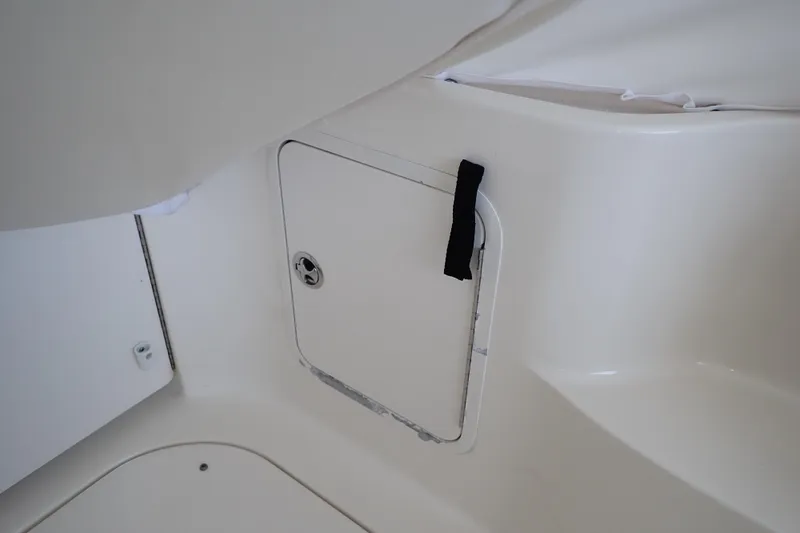 Slide: The Image of Storage compartment on a 2002 Sea Ray 340 Sundancer boat interior. - 52