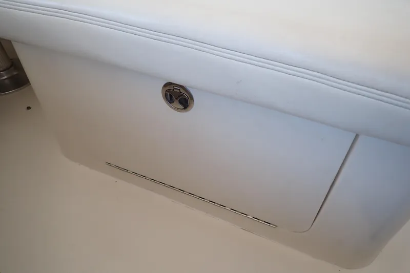 Slide: The Image of White storage compartment on a 2002 Sea Ray 340 Sundancer boat. - 62