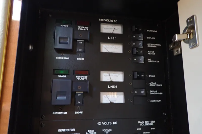 Slide: The Image of Electrical control panel on a 2002 Sea Ray 340 Sundancer boat. - 66