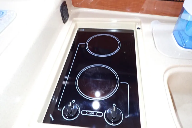 Slide: The Image of Electric stove in 2002 Sea Ray 340 Sundancer yacht kitchen area. - 69