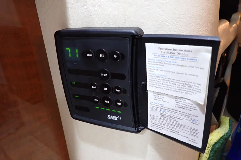 Slide: The Image of Thermostat control panel on a 2002 Sea Ray 340 Sundancer boat, displaying temperature settings. - 75