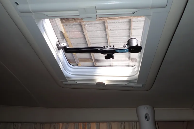 Slide: The Image of Boat cabin hatch of a 2002 Sea Ray 340 Sundancer, partially open. - 88