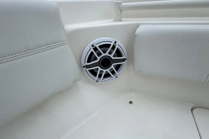 Slide: The Image of 2024 Cobia 240 Dual Console boat interior with speaker detail. - 31