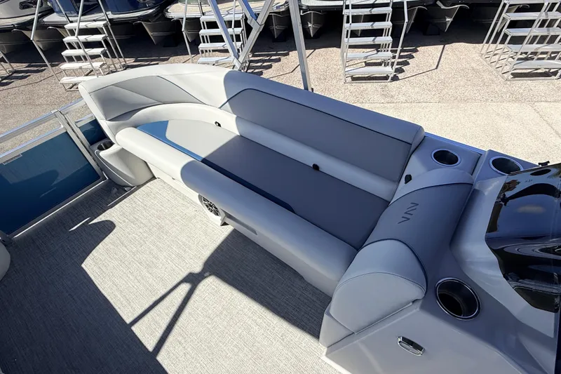 Slide: The Image of 2026 Avalon 2385 Venture 85 Quad Lounger interior with plush seating and cup holders. - 14