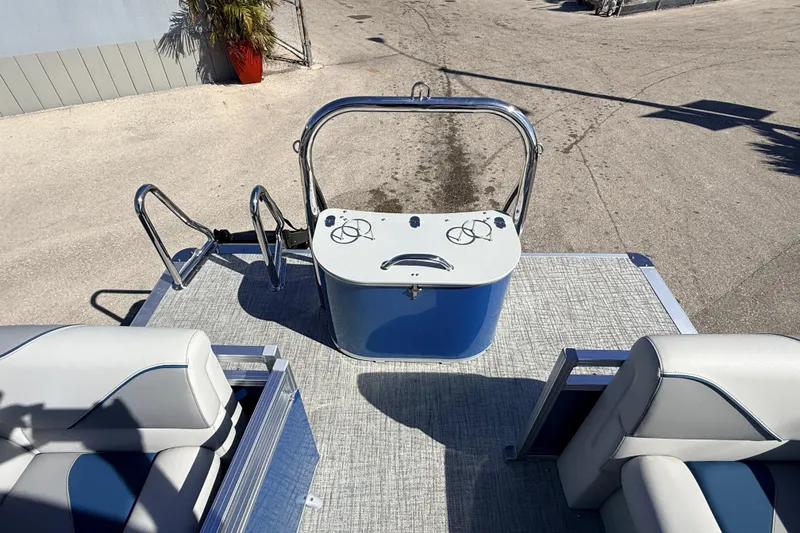 Slide: The Image of 2026 Avalon 2385 Venture 85 Quad Lounger boat deck with seating and control console. - 20