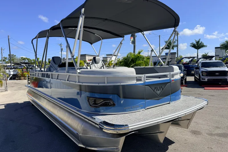 Slide: The Image of 2026 Avalon 2385 Venture 85 Quad Lounger Tri Toon boat in a sunny outdoor setting. - 5