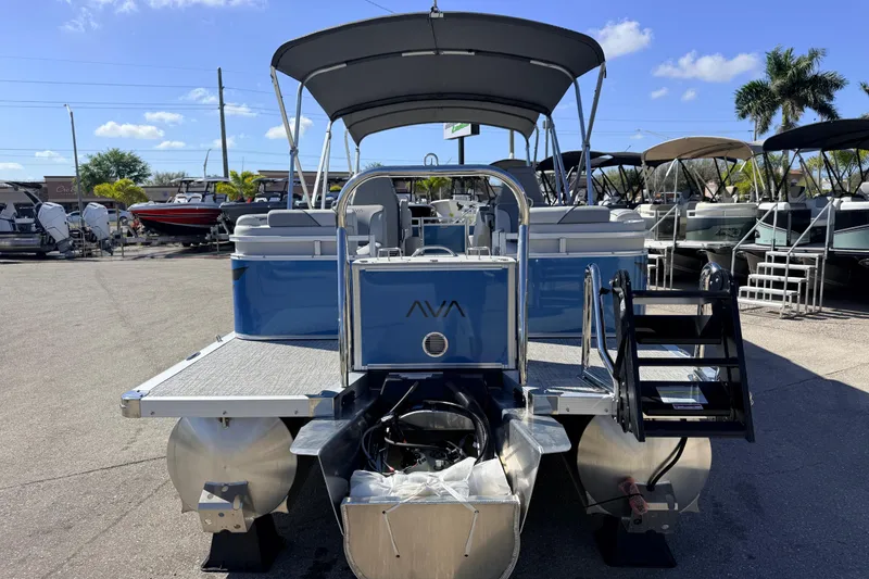 Slide: The Image of 2026 Avalon 2385 Venture 85 Quad Lounger, Tri Toon High Performance boat at marina. - 7