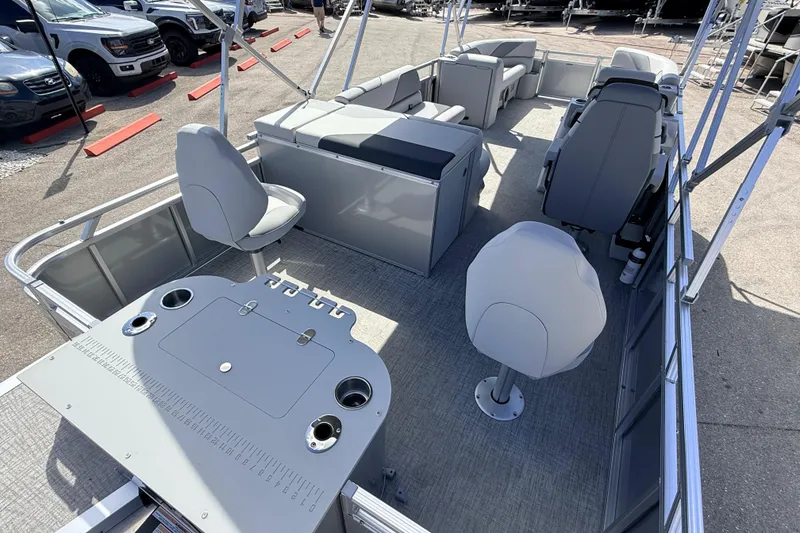 Slide: The Image of 2026 Avalon 2385 Venture 85 Tri Toon boat interior with fishing seats and console. - 10