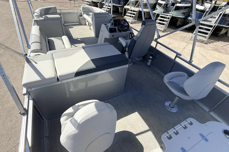 Slide: The Image of 2026 Avalon 2385 Venture 85 Tri Toon boat interior with seating and steering console. - 11