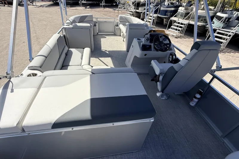 Slide: The Image of 2026 Avalon 2385 Venture 85 Tri Toon boat interior with seating and steering console. - 13