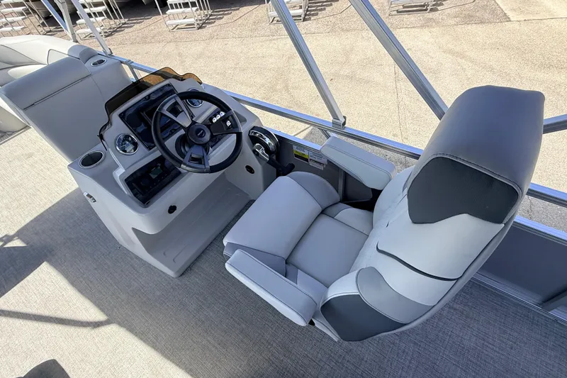 Slide: The Image of Captain's chair and helm of 2026 Avalon 2385 Venture 85 Tri Toon boat. - 14