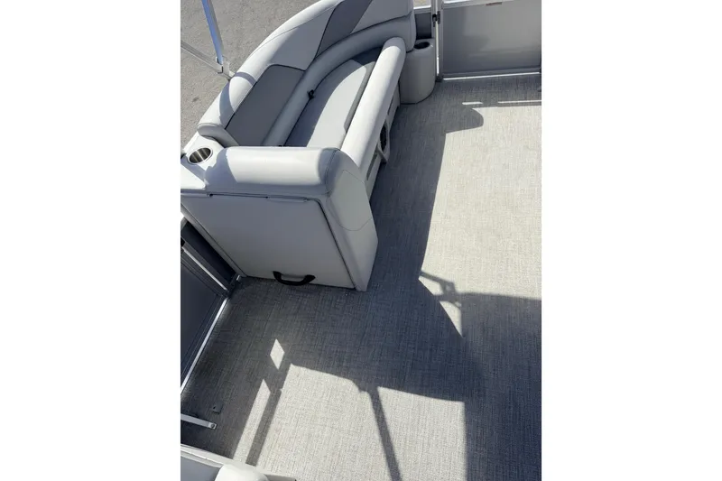 Slide: The Image of 2026 Avalon 2385 Venture 85 Tri Toon boat interior with gray seating and flooring. - 15