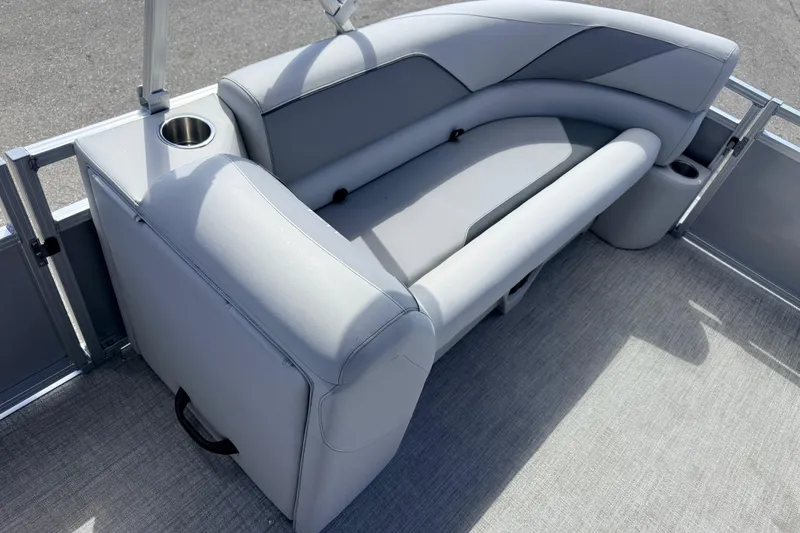Slide: The Image of 2026 Avalon 2385 Venture 85 Tri Toon boat interior with gray seating and cup holder. - 16