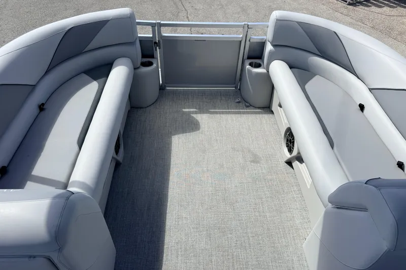 Slide: The Image of 2026 Avalon 2385 Venture 85 Tri Toon boat interior with gray seating and cup holders. - 18