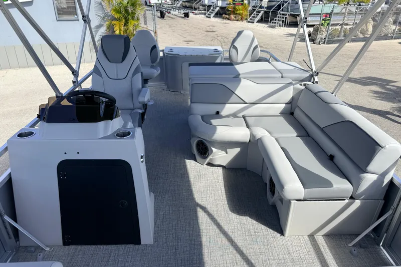 Slide: The Image of 2026 Avalon 2385 Venture 85 Tri Toon boat interior with plush seating and modern helm. - 19