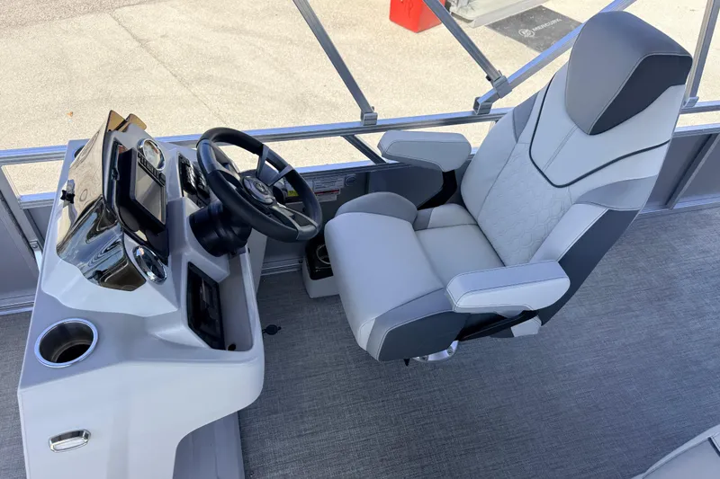 Slide: The Image of Captain's chair and helm of 2026 Avalon 2385 Venture 85 Tri Toon boat. - 21