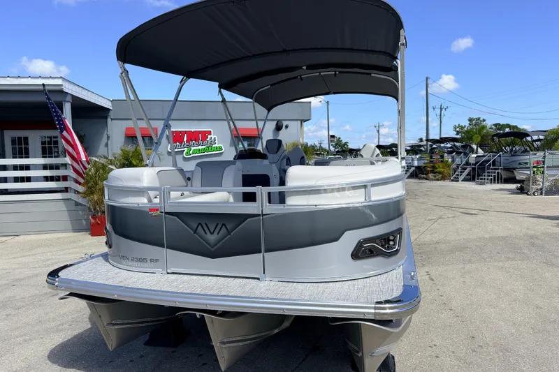 Slide: The Image of 2026 Avalon 2385 Venture 85 Tri Toon boat with canopy at dealership. - 3