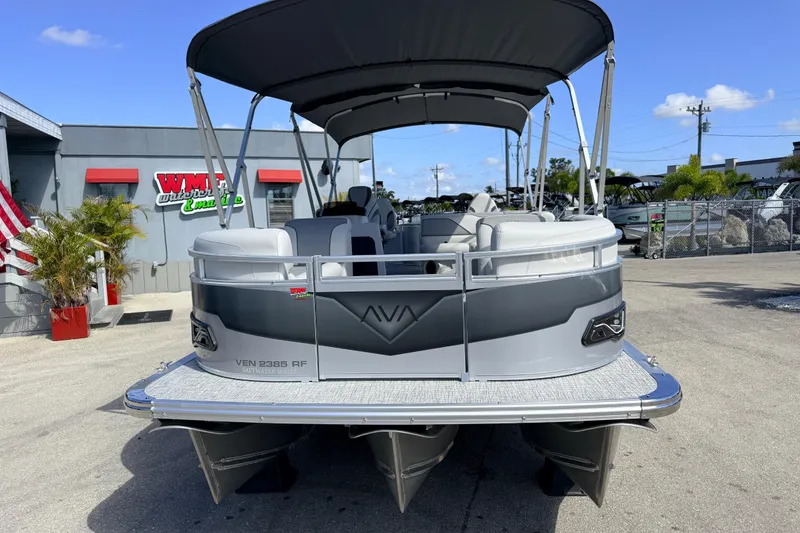Slide: The Image of 2026 Avalon 2385 Venture 85 Rear Fish Tri Toon boat at dealership, showcasing high performance features. - 4