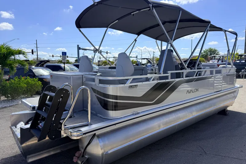 Slide: The Image of 2026 Avalon 2385 Venture 85 Tri Toon boat with canopy, parked outdoors. - 7