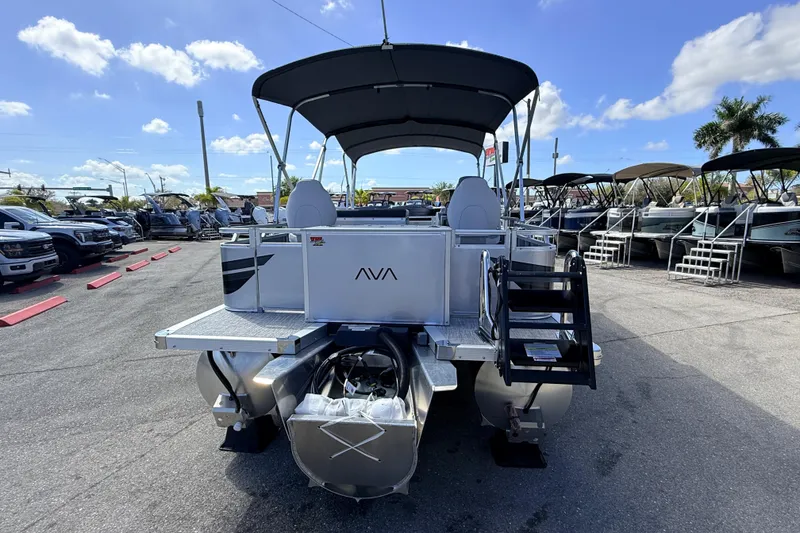 Slide: The Image of 2026 Avalon 2385 Venture 85 Rear Fish Tri Toon boat in a sunny dealership lot. - 8