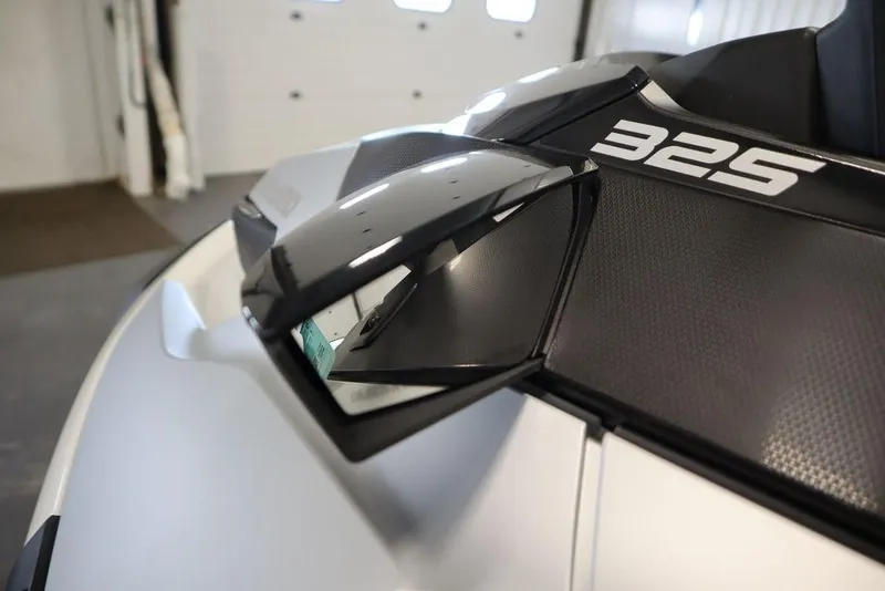 Slide: The Image of 2026 Sea-Doo GTX Limited 325, close-up of sleek design and mirror detail. - 10