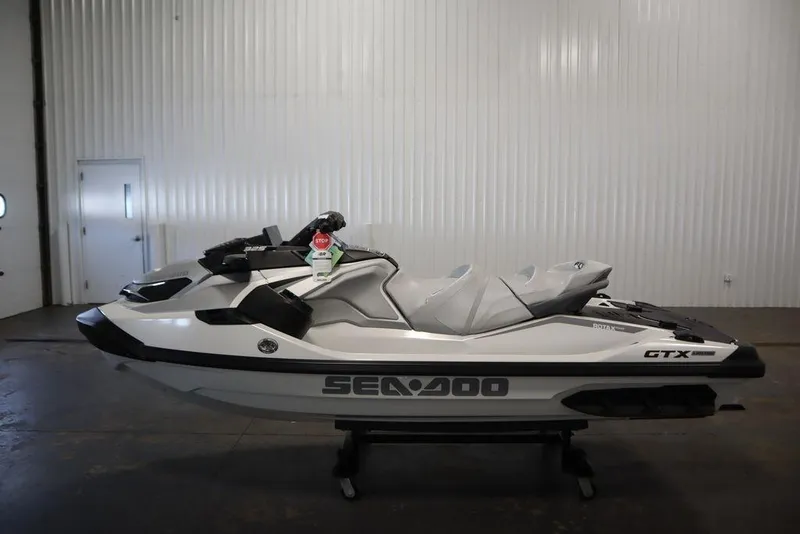 Slide: The Image of 2026 Sea-Doo GTX Limited 325 jet ski in a showroom, side view. - 11