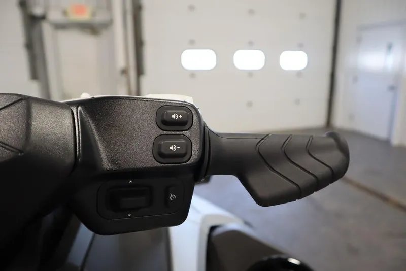 Slide: The Image of Handlebar controls of 2026 Sea-Doo GTX Limited 325 in a garage setting. - 12