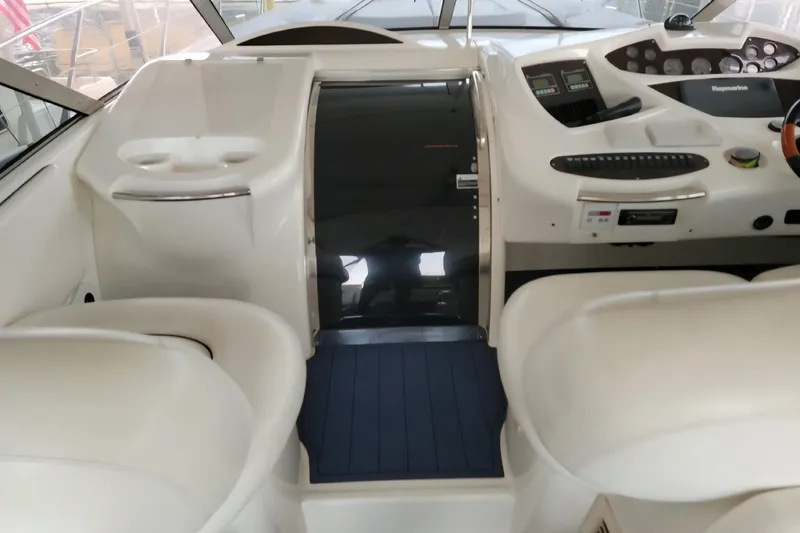 Slide: The Image of Interior cockpit of 2004 Sunseeker Predator 56 yacht, featuring sleek controls and seating. - 14