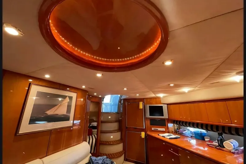 Slide: The Image of Luxurious interior of 2004 Sunseeker Predator 56 yacht with elegant wood finishes and modern amenities. - 23