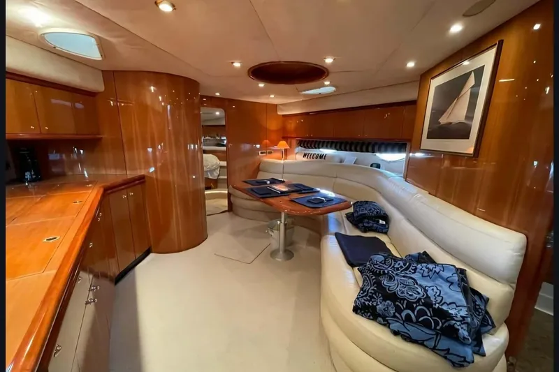Slide: The Image of Luxurious interior of 2004 Sunseeker Predator 56 yacht with elegant wood finishes and plush seating. - 25