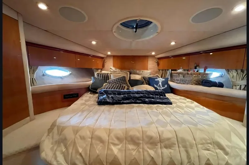Slide: The Image of Luxurious cabin interior of 2004 Sunseeker Predator 56 yacht with elegant bedding and decor. - 27