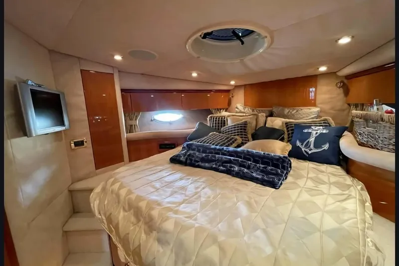 Slide: The Image of Luxurious cabin interior of 2004 Sunseeker Predator 56 yacht with plush bedding and decor. - 28