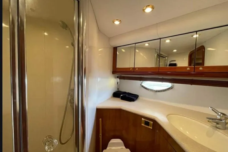 Slide: The Image of Luxurious bathroom in 2004 Sunseeker Predator 56 yacht with shower and vanity. - 29