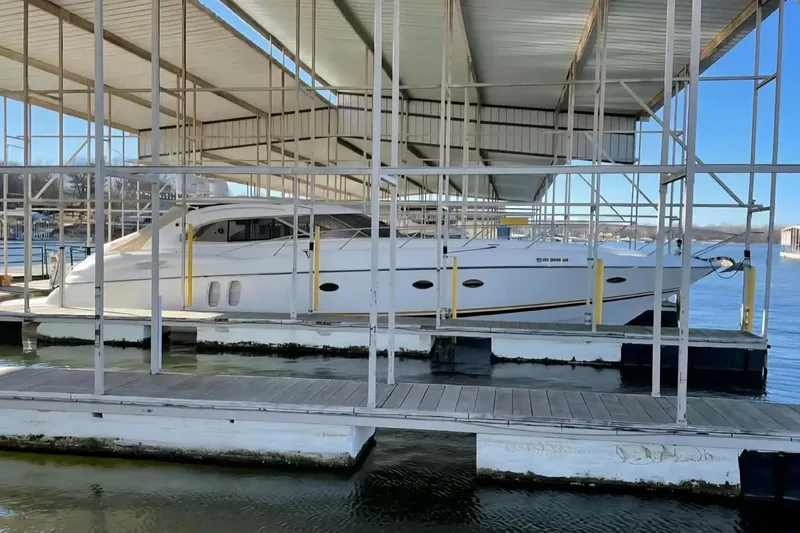 Slide: The Image of 2004 Sunseeker Predator 56 yacht docked under covered marina. - 4