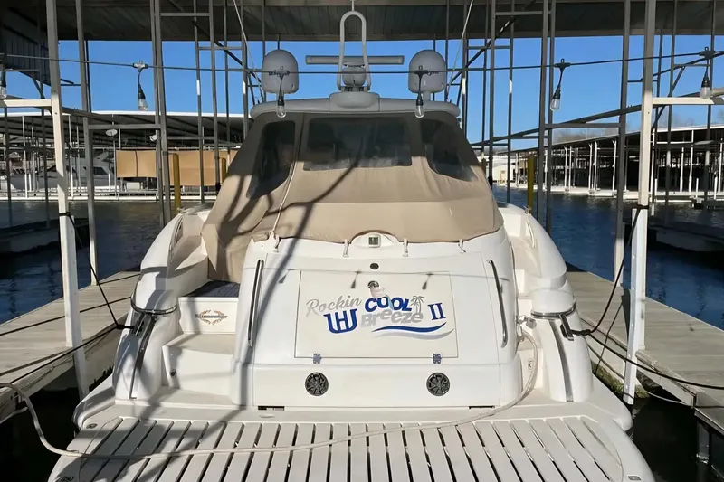 Slide: The Image of 2004 Sunseeker Predator 56 yacht docked, rear view with "Rockin Cool Breeze II" name. - 5