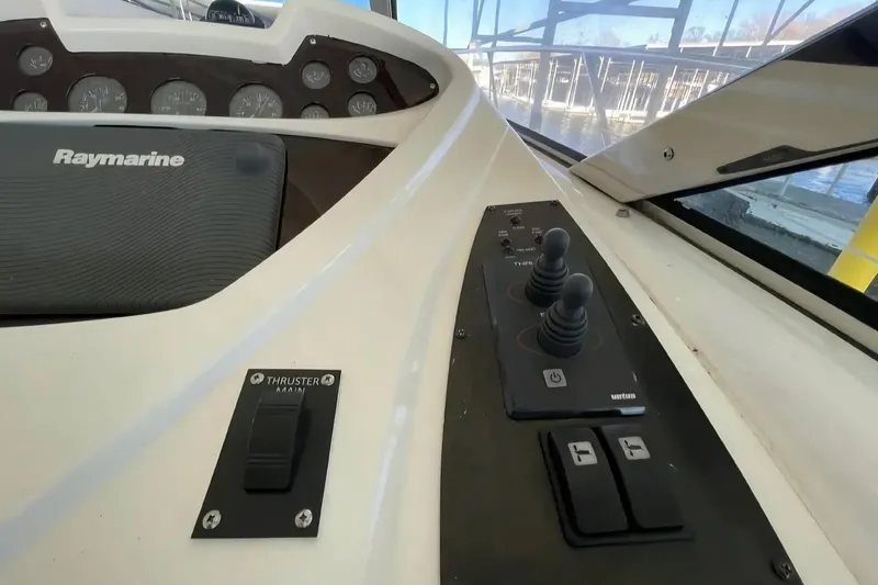Slide: The Image of Control panel of a 2004 Sunseeker Predator 56 yacht with Raymarine equipment. - 8