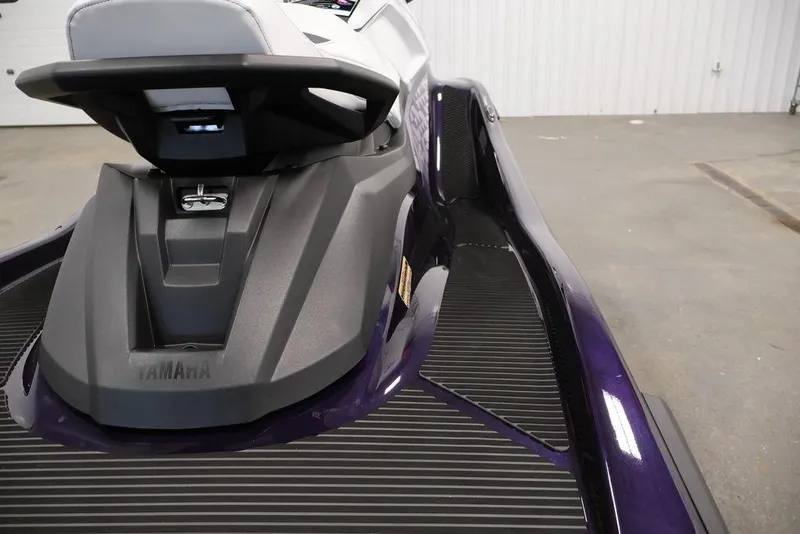 Slide: The Image of 2025 Yamaha WaveRunner VX Cruiser, sleek design, rear view in a showroom setting. - 19