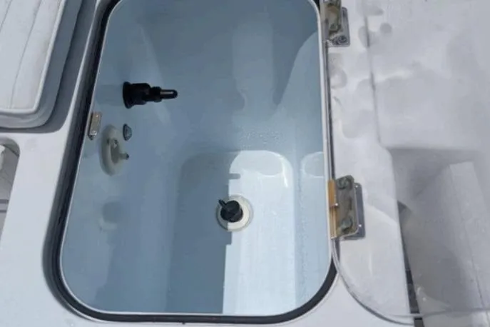 Slide: The Image of Livewell compartment on a 2016 Southport 272 TE boat, open and empty. - 10