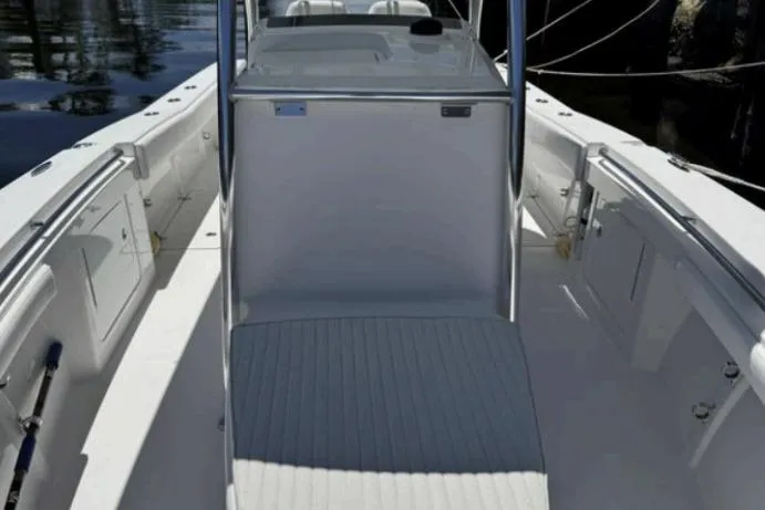 Slide: The Image of 2016 Southport 272 TE boat interior with sleek white deck and console. - 11