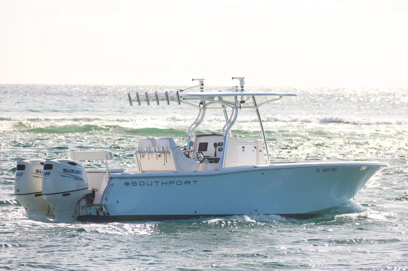 Slide: The Image of 2016 Southport 272 TE boat with dual Suzuki engines on the ocean. - 17