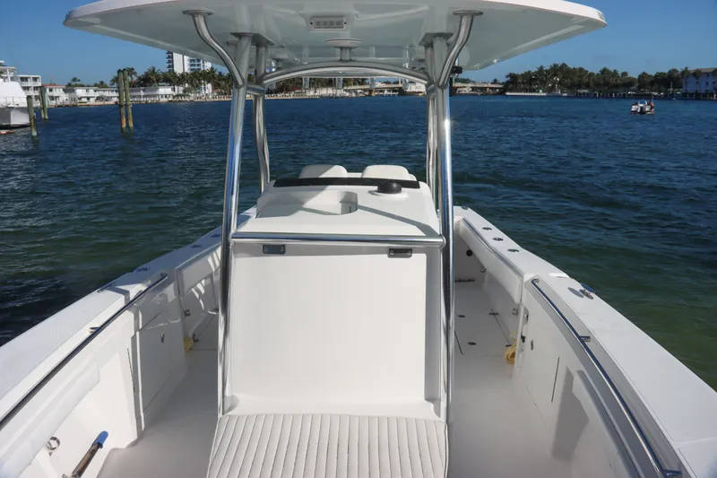 Slide: The Image of 2016 Southport 272 TE boat on water, showcasing spacious deck and sleek design. - 23