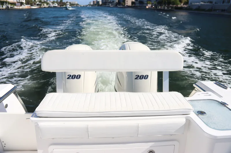 Slide: The Image of 2016 Southport 272 TE boat with dual 200 horsepower engines cruising on water. - 24