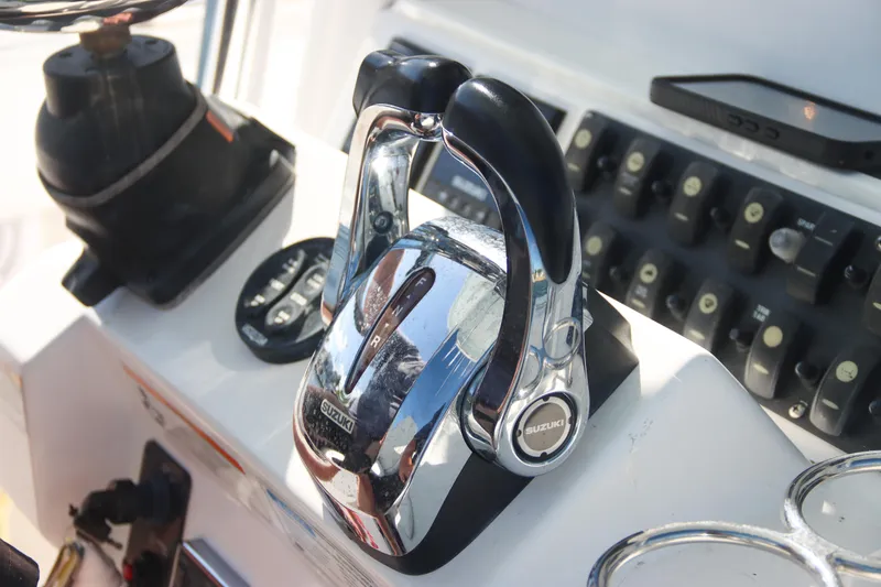 Slide: The Image of Close-up of 2016 Southport 272 TE boat controls with Suzuki throttle. - 25