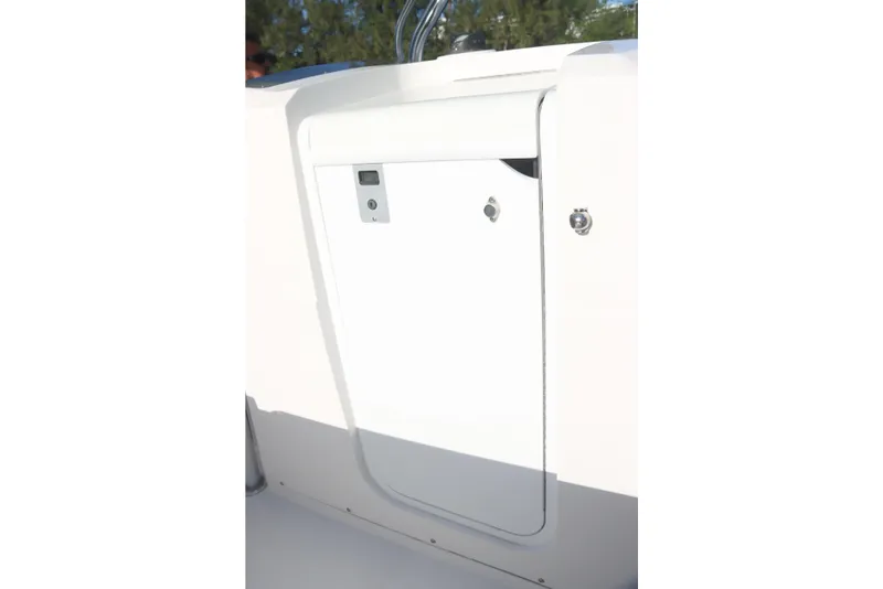 Slide: The Image of 2016 Southport 272 TE boat console storage compartment with secure latch. - 33