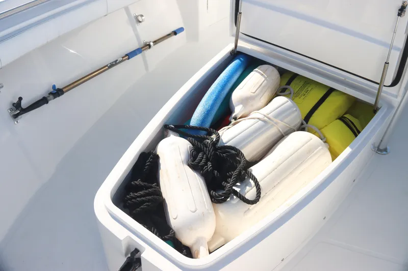 Slide: The Image of Storage compartment on 2016 Southport 272 TE boat with fenders and gear. - 34