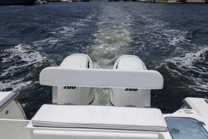 Slide: The Image of 2016 Southport 272 TE boat with twin 200 engines cruising on water. - 6