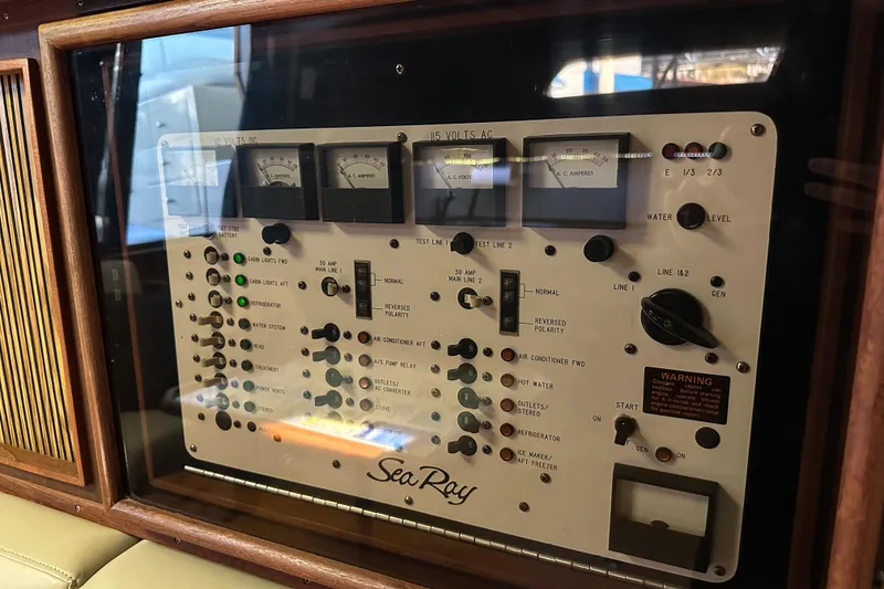 Slide: The Image of Control panel of a 1986 Sea Ray 390 Express Cruiser with gauges and switches. - 37