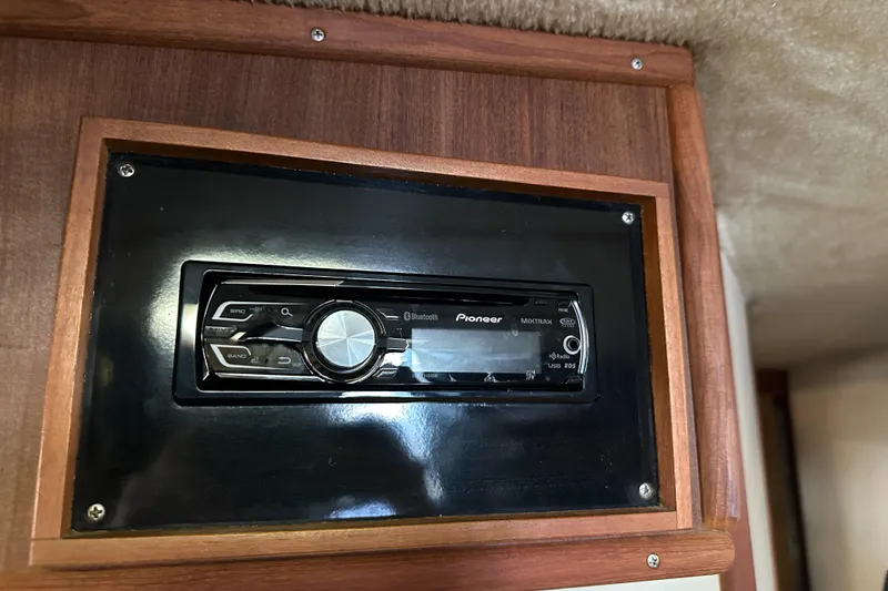Slide: The Image of Pioneer stereo system in 1986 Sea Ray 390 Express Cruiser, wooden paneling. - 38