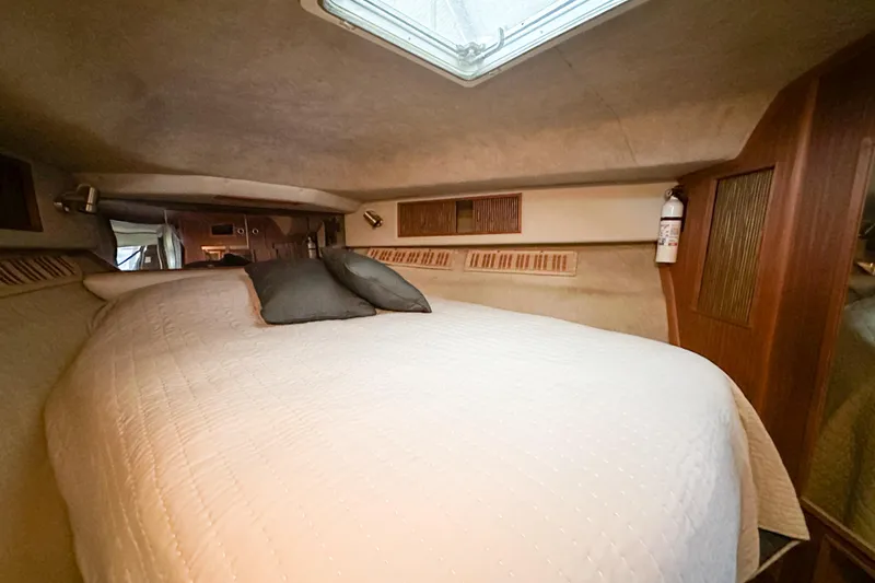Slide: The Image of Interior cabin of 1986 Sea Ray 390 Express Cruiser with bed and skylight. - 60