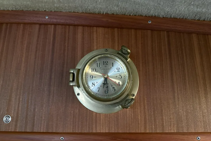 Slide: The Image of Brass clock on 1986 Sea Ray 390 Express Cruiser wooden interior. - 73